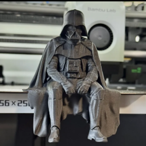 Sad Darth Vader sitting on a ledge figurine
